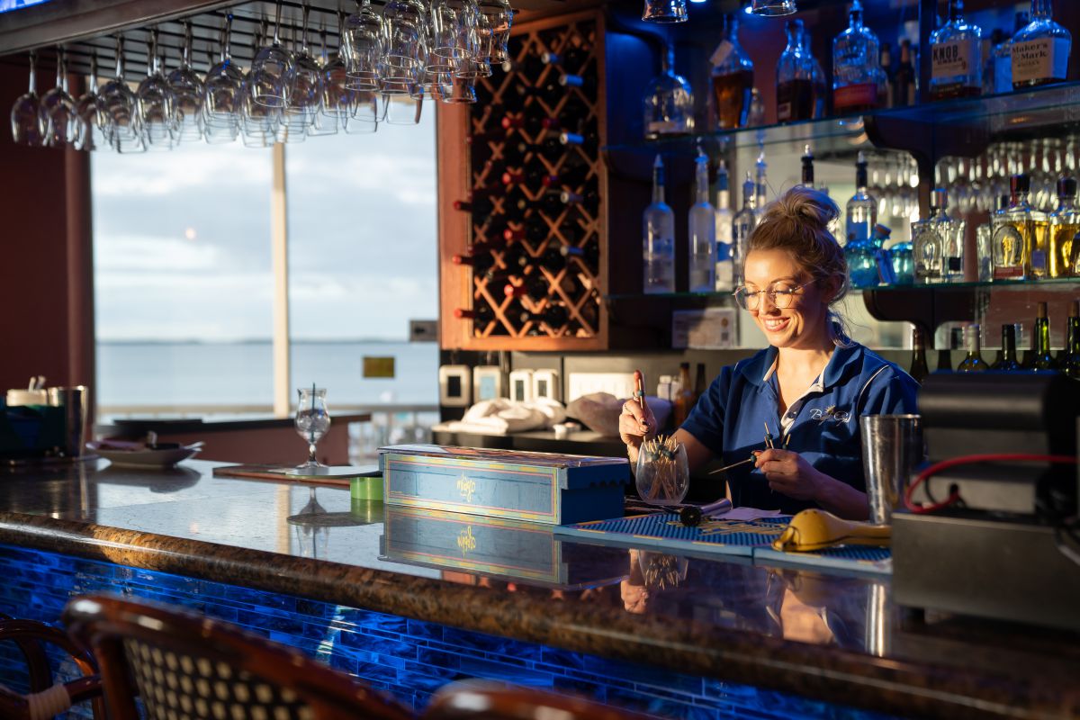 Warm evening light glowing across the Bayside Grille waterfront